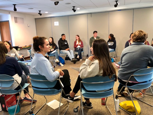 Students and others sit in a circle as they participate in one of UC San Diego's dialogue programs (Center for Student Involvement - Communication & Leadership)